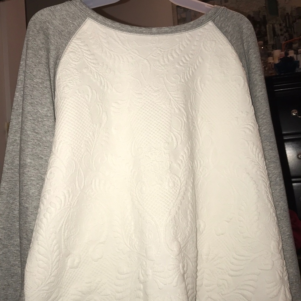 White and gray sweater.